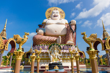 Budai or Pu-Tai or Happy Buddha or Laughing Big Buddha statue at Wat Plai Laem Temple in the Ko-Samui or Samui island in Thailand