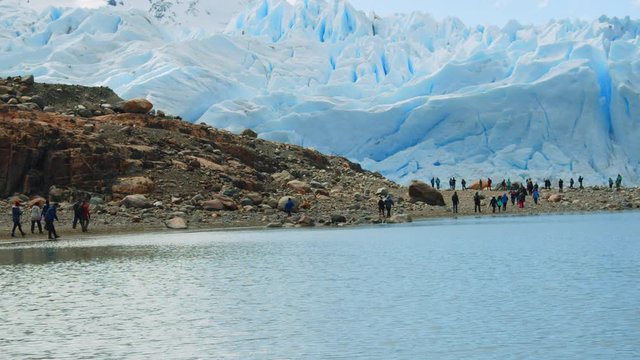 Wide View of Group of Tourists Walking toward Perito Moreno Glacier, Patagonia, Argentina.
People Trekking at Los Glaciers National Park.
