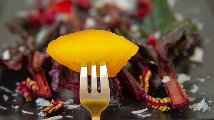 Yellow Beet over a bed of healthy greens
