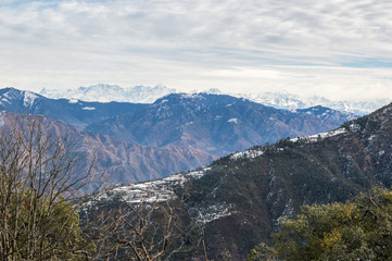 Naklejka premium Hills and the Himalayas seen from Mussoorie, India