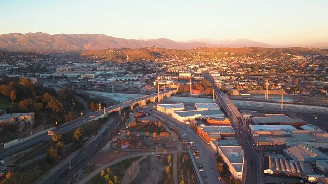 Aerial Drone View of Beautiful Mountains in Gorgeous Los Angeles California near Glendale and Downtown Los Angeles on a Beautiful Sunset Afternoon Clear Day with Cars Passing on Street Below 4K