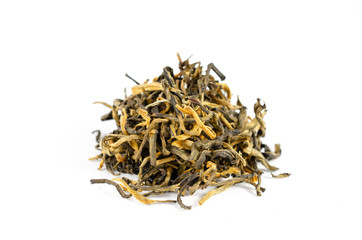 Pile of dry white tea leaves on a white background close-up.