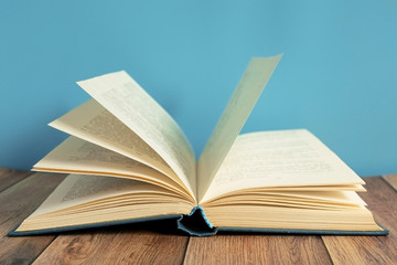 Open book. A stack of old books with yellow pages. Book binding. Knowledge and education. Literature in the library..