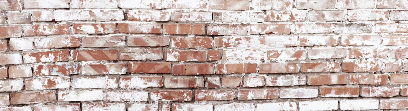 Rustic red brick background with white paint