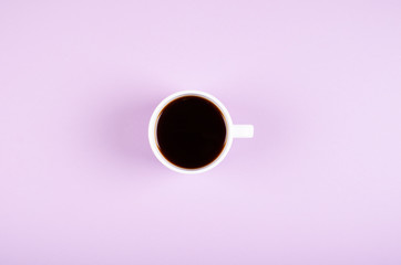 Coffee cup composition on purple background. Flat lay.