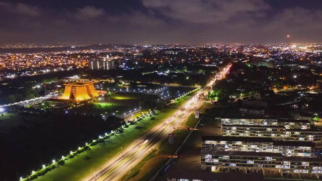 Aerial night timelapse of city with moving cars in Ghana