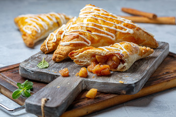Puff pastry turns with apple filling.