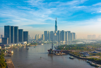 Saigon, Vietnam - CIRCA Jan 2020: Long exposure Saigon aerial cityscape, showing Landmark 81 Building in the background, MRT lin construction in the right, and Saigon River.