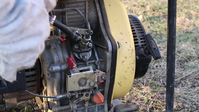 Close-up. The master starts the station through manual start to generate electricity.
