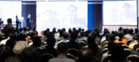 Rear view of the people blur in the conference hall. Franchise seminar, Business and...
