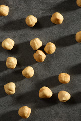 Hazelnuts on the black stone texture
