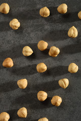 Hazelnuts on the black stone texture