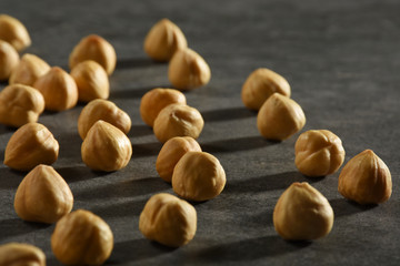 Hazelnuts on the black stone texture