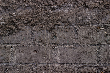 concept and texture of the background - the walls of the house with rough bricks
