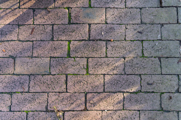 Close up of cobblestones with light and shadow - top view