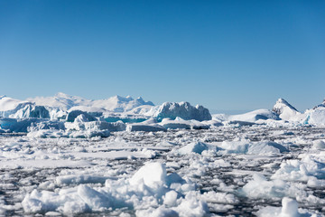 Pack ice and icebergs floating in the cold water of Antarctica © Gabi