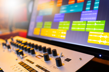 music synthesizer and waveform on computer monitor