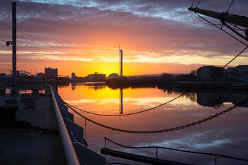 An amazing sunrise over the river Clyde in Glasgow, Scotland on a cold clear winter morning