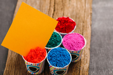 Indian festival holi, colors cup with copy space 
