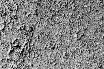 Texture of a concrete wall with cracks and scratches which can be used as a background