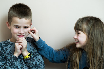 Two children boy and girl fooling around having fun together. Happy childhood concept.