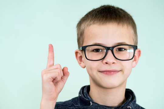 Close up portrait of a child school boy wearing glasses.