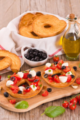 Friselle with tomatoes and mozzarella cheese.