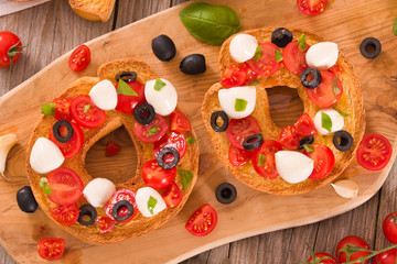 Friselle with tomatoes and mozzarella cheese.