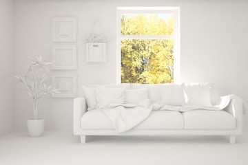 Stylish room in white color with sofa and autumn landscape in window. Scandinavian interior design. 3D illustration