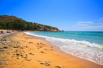 Beautiful sandy Cala Comte beach with azure blue sea water, Ibiza island, Spain