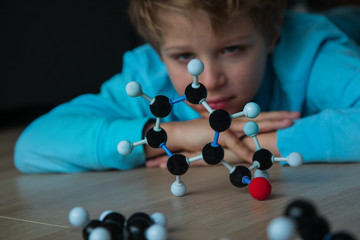child learning chemistry, building benzene ring, engineering and STEM