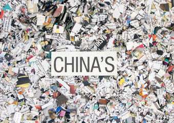 Newspaper confetti from above with the word CHINA'S