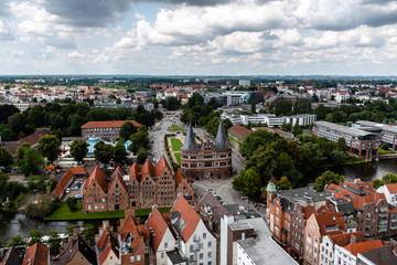 Naklejka premium Aerial view of historic centre of Lubeck with Holstentor Gate