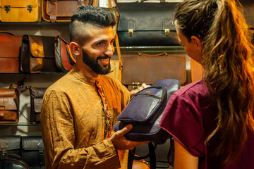 egypt sallerman showing his bags at arambol goa market