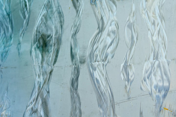 wavy pattern on a silvery  surface, metal processing
