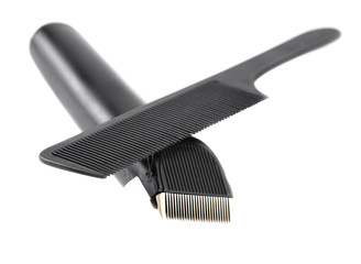 Hair clipper and comb on a white background