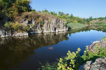 Fototapeta na wymiar Stone cliff on the river bank