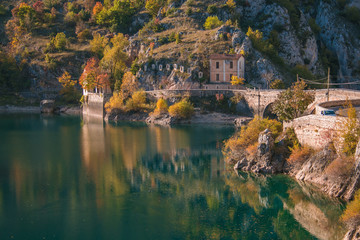 Fototapeta na wymiar Autumn view of Lake of San Domenico in the municipality of Villalago in the province of L'Aquila. Abruzzo - Italy