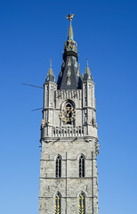 Fototapeta na wymiar Belfry of Ghent, 91-metre-tall medieval tower which overlooks the old city centre of Ghent / Gent, East Flanders, Belgium