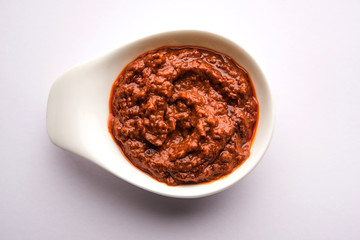 Homemade Tandoori Paste or Marinade mixture, in a bowl. used for grilled chicken or Paneer or...