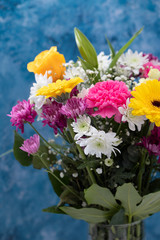 Naklejka na ściany i meble bouquet of beautiful flowers with blue background