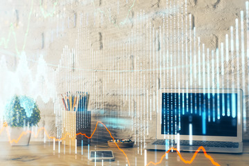 Financial chart drawing and table with computer on background. Double exposure. Concept of international markets.
