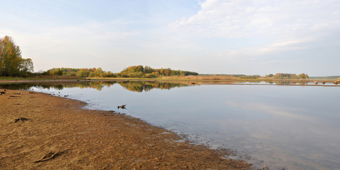 Autumn fishing on the Rybinsk Reservoir, beautiful panorama.