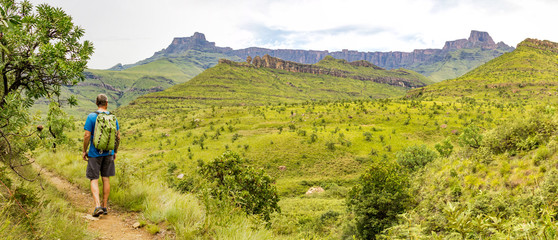 A hiking man enjoying the panorama of the Amphitheatre and to the rock formation Policeman's...