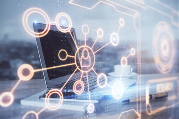 Computer on desktop with social network theme icon. Multi exposure. Concept of international connections.