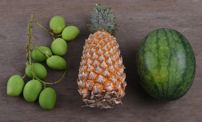 Tropical fruit on wooden table