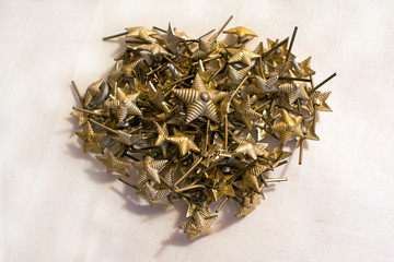 Metal stars for sewing on military uniforms