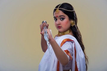 child dressed up as goddess durga