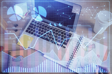 Double exposure of man's hands writing notes of stock market with forex chart.