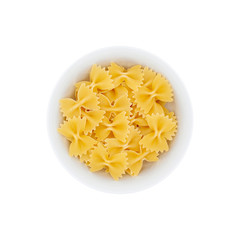Pile of farfalle paste in a white bowl isolated